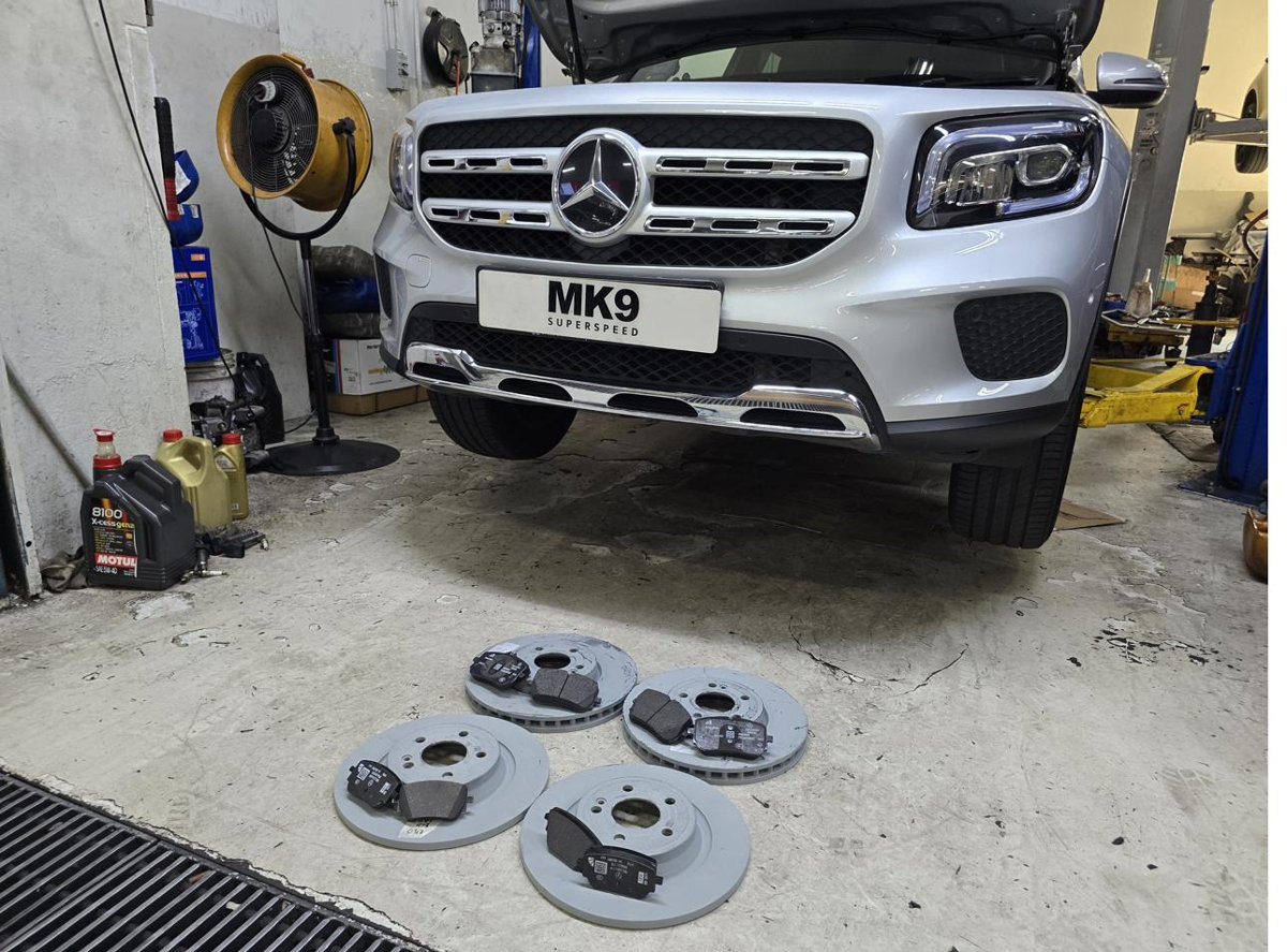 Mercedes GLB with new brake discs and pads laid out